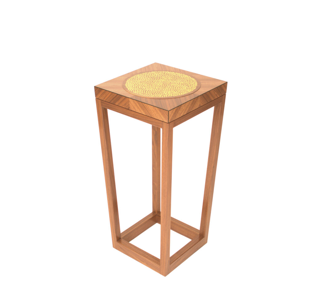 A side table in American Walnut with a Gilded Top